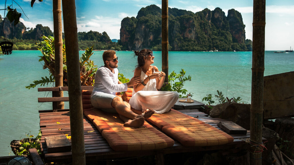A couple lounging in a tropical paradise - Learn How to Measure the Success of Your Incentive Travel Program