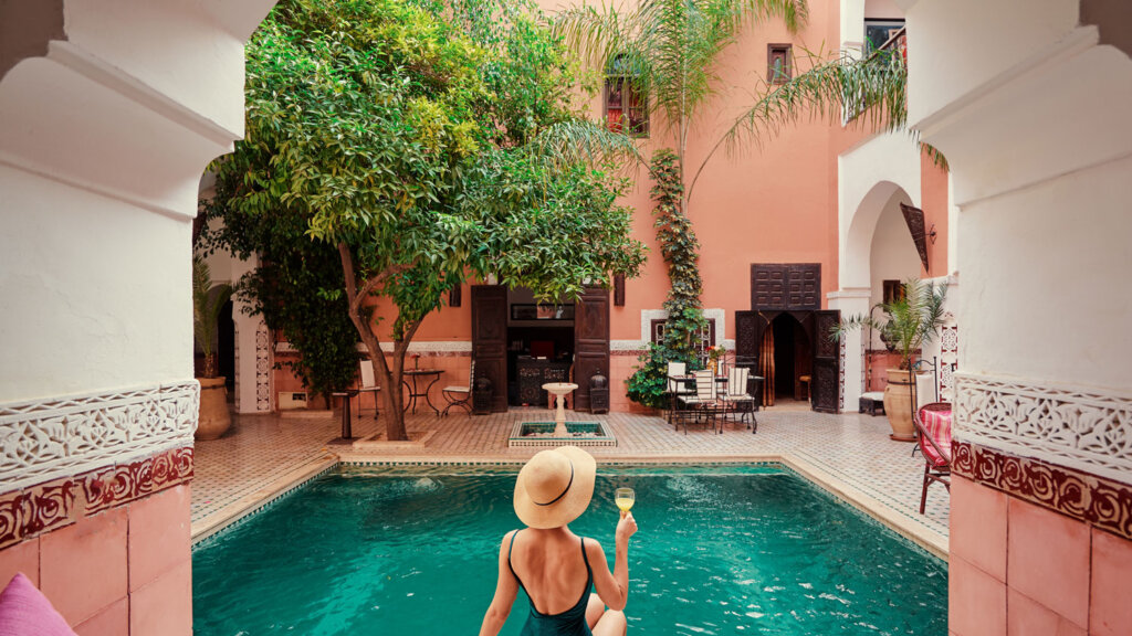 Luxury travel advisor enjoying a drink in a luxury hotel