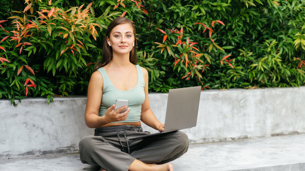 A woman working with AI tools to help her luxury travel business become more efficient.